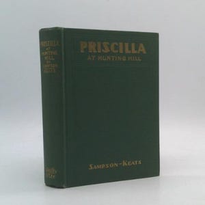 May include: A hardcover book titled "Priscilla at Hunting Hill" by Sampson-Keats. The book has a dark green cover with gold lettering. The title and author's name are prominently displayed on the spine and front cover.