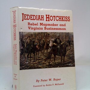 May include: Book cover with a painting of Confederate soldiers on horseback. The title is "JEDEDIAH HOTCHKISS Rebel Mapmaker and Virginia Businessman" by Peter W. Roper.  Foreword by Archie P. McDonald.