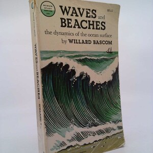 May include: A vintage book cover with a green and white illustration of waves crashing on a beach. The title is "Waves and Beaches: The dynamics of the ocean surface" by Willard Bascom. The book is part of the Science Study Series.