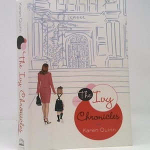 May include: A hardcover book titled "The Ivy Chronicles" by Karen Quinn. The cover features an illustration of a woman and child in front of a school building. The book's spine displays the title vertically. The cover has a white background with red and pink accents.