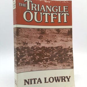 May include: A hardcover book titled "The Triangle Outfit" by Nita Lowry. The cover features a sepia-toned image of cowboys herding cattle, with the title in large white letters against a red background.