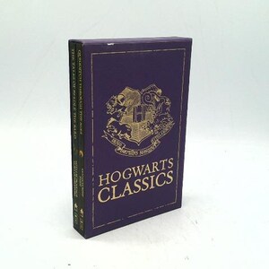 May include: A purple book set titled "Hogwarts Classics" with gold lettering and a crest design. The spine shows the titles of the books included in the set. The set is displayed on a white background.