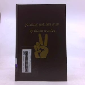 May include: A hardcover book titled "Johnny Got His Gun" by Dalton Trumbo. The cover is dark brown with gold lettering and a gold hand making a peace sign. A sticker with text is on the spine.