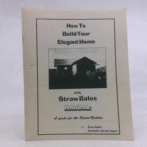 May include: A white instructional manual titled How To Build Your Elegant Home with Straw Bales. The cover features a black and white illustration of a house, the text Manual: A guide for the Owner-Builder, and author Steve Kemble.