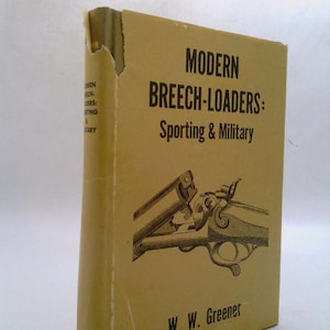 May include: A vintage book titled "Modern Breech-Loaders: Sporting & Military" by W. W. Greener. The cover is tan with black text and a detailed illustration of a firearm. The book's spine shows some wear.