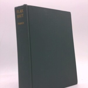 May include: A dark green hardcover book with the title "Flak Bait" in gold lettering on the spine.