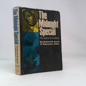 May include: A vintage book titled "The Midnight Special" with a black cover featuring a portrait and a guitar illustration. The spine reads "The Midnight Special" and the authors' names. The book is in good condition.