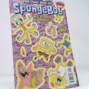 May include: A white ceramic mug with a black handle and the text "But first, coffee" in a black, handwritten-style font. The mug is on a white surface.