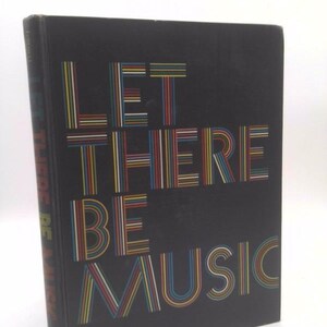 May include: A black book with the title "Let There Be Music" in colorful, striped letters.