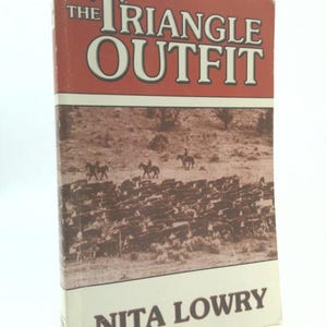 May include: A vintage book titled "The Triangle Outfit" by Nita Lowry. The cover features a sepia-toned image of cowboys herding cattle. The title is in large white letters on a red background.