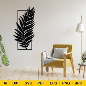 Peut inclure: Silhouette noire d'une feuille de palmier dans un cadre rectangulaire, montée sur un mur blanc. Un fauteuil jaune avec un plaid blanc est placé devant le mur, à côté d'un lampadaire avec un abat-jour blanc.