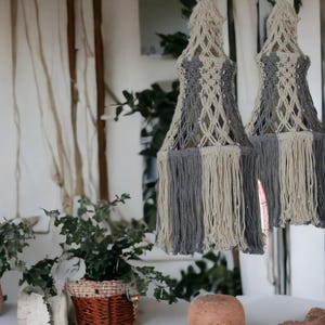 Beautiful white and gray macrame lampshade of Boho style.
