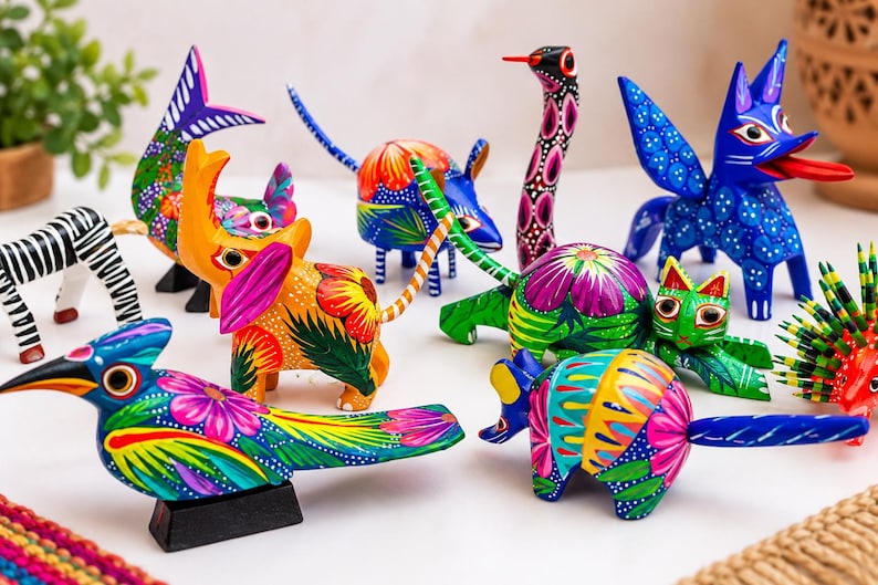 May include: A collection of small, hand-painted wooden animal figurines featuring vibrant, multi-colored patterns. The group includes a bird, elephant, zebra, cat, and other creatures, all decorated with intricate floral and geometric designs.