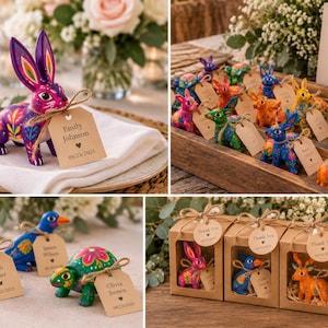 May include: Small hand-painted animal figurines including rabbits, cats, birds, and turtles with vibrant floral patterns. Each figure features a brown paper tag tied with twine, displaying names and dates, with some packaged in individual boxes.