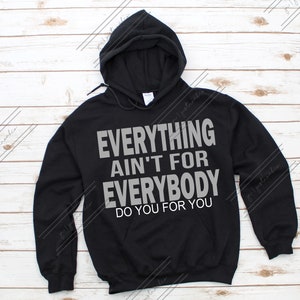 May include: Black hooded sweatshirt with the text "EVERYTHING AIN'T FOR EVERYBODY DO YOU FOR YOU" in grey lettering.