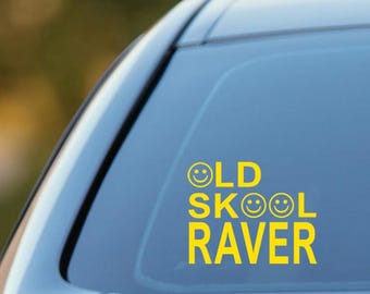 May include: Yellow vinyl sticker with the text "OLD SKOOL RAVER" with smiley faces in place of the "O" in "OLD" and the "O" in "SKOOL".