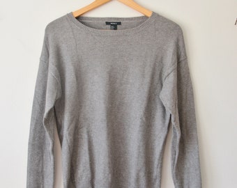 very soft, intentionally distressed knit gray sweater
