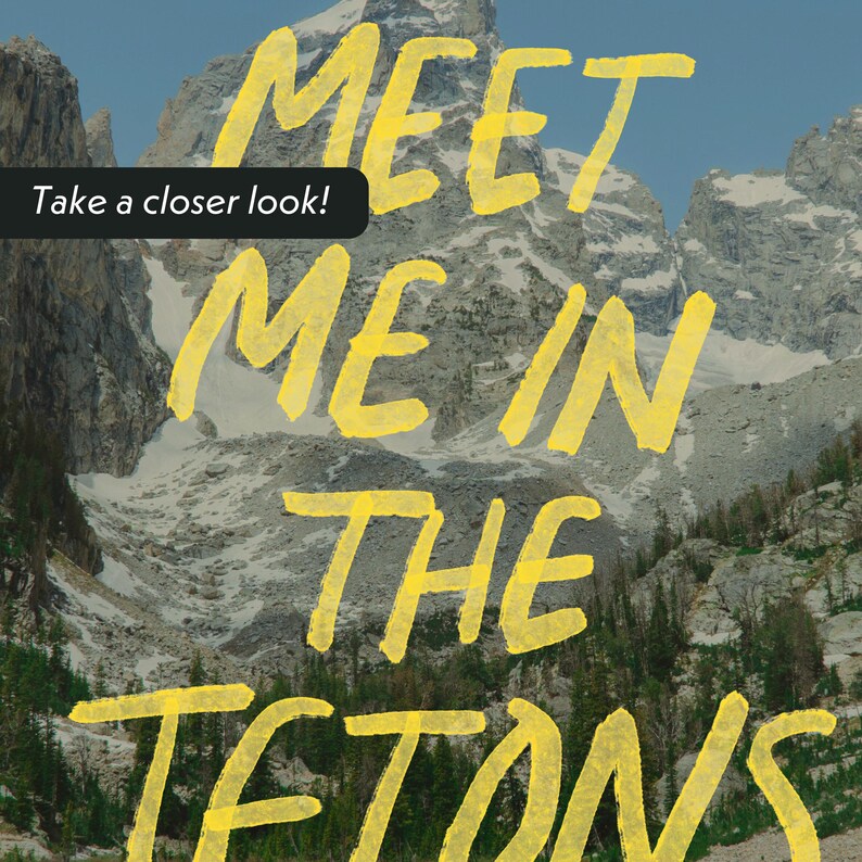 May include: A yellow text graphic against a backdrop of a mountain range. The text reads "Meet me in the Tetons". The text is written in a bold, handwritten style. The text is superimposed over a photograph of a mountain range with snow-capped peaks.