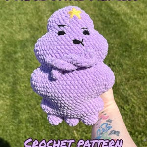 May include: A purple crochet plush toy shaped like a cloud with a yellow star on its forehead and black embroidered facial features. The text PURPLE SPACE PRINCESS, CROCHET PATTERN, and CROCHETMADEBYELI is displayed in purple letters on the image.