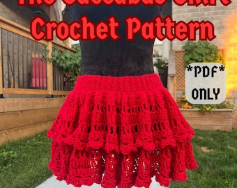 Peut inclure: Un jupon rouge au crochet avec un design à volants est présenté sur un mannequin noir. Le texte "The Succubus Skirt Crochet Pattern" est en rouge, avec "*PDF* ONLY" et le compte Instagram "@crochetmadebyeli".