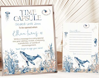 Può includere: Un cartello blu e bianco di capsula del tempo con illustrazioni di balene e vita marina. Il cartello dice "Time Capsule" e "Sealed until 20xx" e "To be opened when Ethan turns 18". C'è una carta bianca con le stesse illustrazioni e il testo "Caro Ethan".