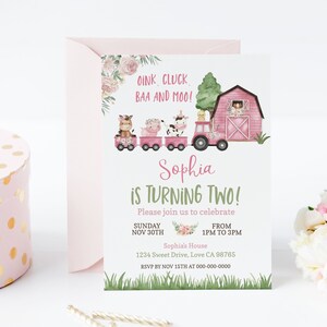 May include: Pink and green farm-themed birthday invitation with a pink barn, a tractor, and farm animals. The text reads "Oink, Cluck, BAA and Moo! Sophia is turning two! Please join us to celebrate Sunday, Nov 30th from 1pm to 3pm. Sophia's House, 1234 Sweet Drive, Love CA 98765. RSVP by Nov 15th at 000-000-0000."