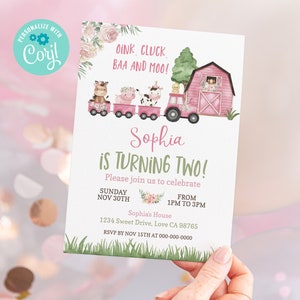 May include: A pink and green farm-themed birthday invitation for a girl turning two. The invitation features a pink tractor pulling a train with farm animals, a pink barn, and the text "Sophia is turning two!"  Please join us to celebrate Sunday Nov 30th from 1pm to 3pm. Sophia's House 1234 Sweet Drive, Love CA 98765 RSVP by Nov 15th at 000-000-0000