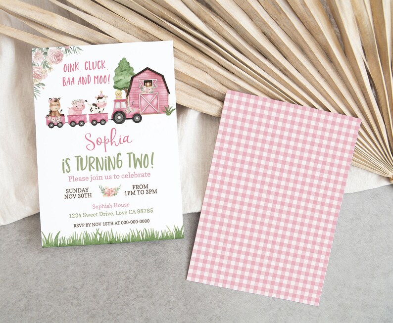 May include: A pink and green farm-themed birthday invitation for a girl's second birthday party. The invitation features a pink tractor pulling a train of farm animals, a red barn, and the text "Sophia is turning two!"  Please join us to celebrate Sunday Nov 30th from 1pm to 3pm. Sophia's House 1234 Sweet Drive, Love CA 98765 RSVP by Nov 15th at 000-000-0000