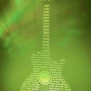 May include: A green and white guitar-shaped night light with the lyrics to the Rolling Stones song "Honky Tonk Women" printed on it. The lyrics include the lines "I met a gin soaked bar room queen in Memphis, she tried to take me upstairs for a ride".