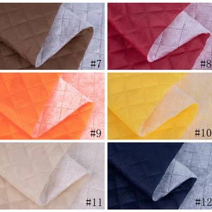 May include: Four different quilted fabrics in various colors, including brown, red, orange, yellow, beige, and navy blue. Each fabric has a diamond pattern and is shown folded with the white backing visible. The fabric samples are labeled with numbers 7, 8, 9, 10, 11, and 12.