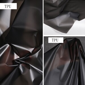 May include: Close-up of a black, translucent TPU fabric. The fabric is smooth and shiny, with a slight sheen. The fabric is folded in a few places, showing its flexibility. The text "TPU" is visible in the top left corner of the image.