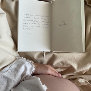 Premium linen pregnancy journal keepsake in soft beige with embossed gold title on a white background GROWING YOU. Pregnancy quote inside the keepsake book