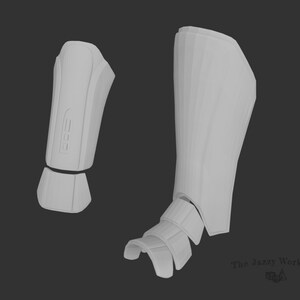 Puede incluir: Un modelo impreso en 3D de un par de espinilleras blancas para cosplay o la fabricación de disfraces. Las espinilleras están hechas de varias piezas que encajan entre sí. El modelo se muestra de frente y de lado.