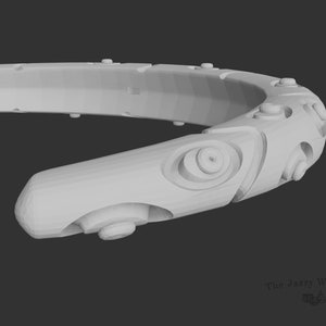 May include: A white, 3D-printed, circular, geometric design with a textured surface. The design features multiple circular and oval shapes, and a series of small, raised dots.