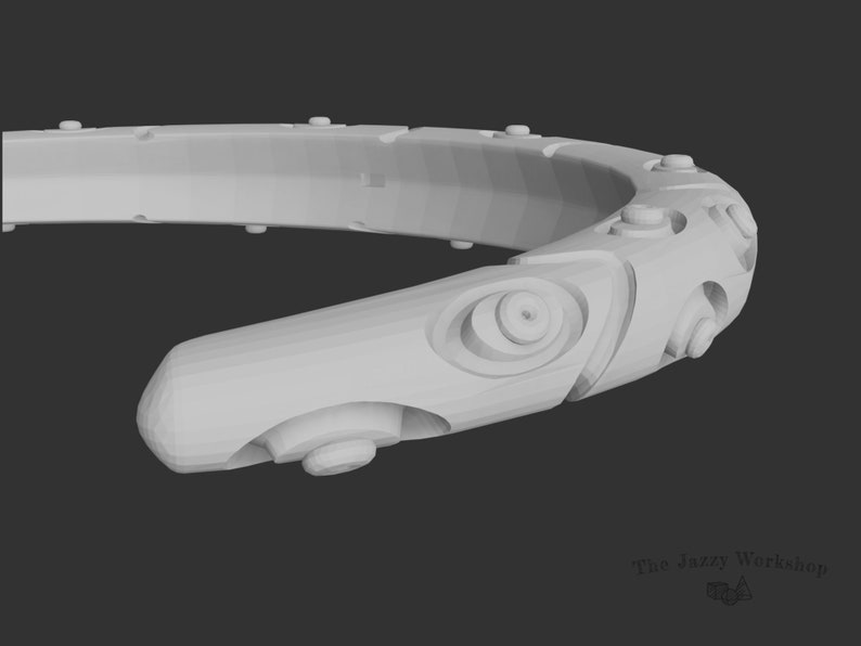 May include: A white, 3D-printed, circular, geometric design with a textured surface. The design features multiple circular and oval shapes, and a series of small, raised dots.