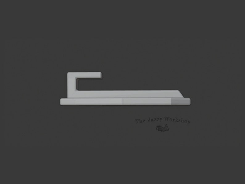 May include: A silver metal hook with a flat base. The hook is designed to hang items on a wall.