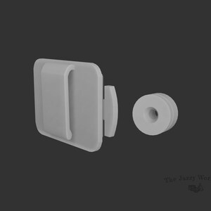 May include: A white plastic clip with a small hole in the center. The clip is designed to attach to a surface and has a small, white plastic ring attached to it.
