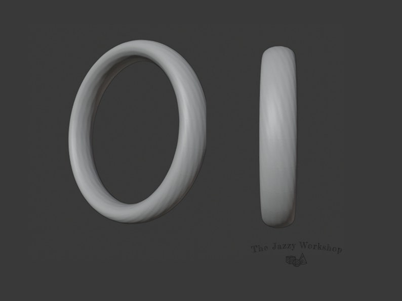 May include: A simple, smooth, silver ring with a slightly rounded edge.