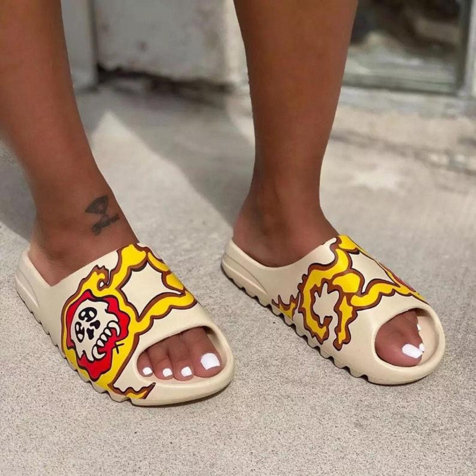 yeezy slides at the beach