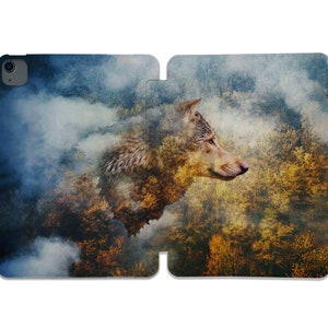 May include: A wolf's head emerges from a misty forest, its fur blending with the trees and foliage. The wolf's eyes are sharp and alert, and its expression is both fierce and serene. The background is a blur of greens, browns, and yellows, creating a sense of depth and mystery.