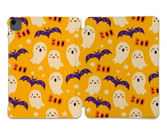 May include: A yellow and orange phone case with a pattern of white ghosts, purple bats, and the word "BOO" repeated throughout.