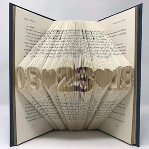 Personalized date folded book art handmade from a hardcover book, custom anniversary, wedding, or special date keepsake gift.