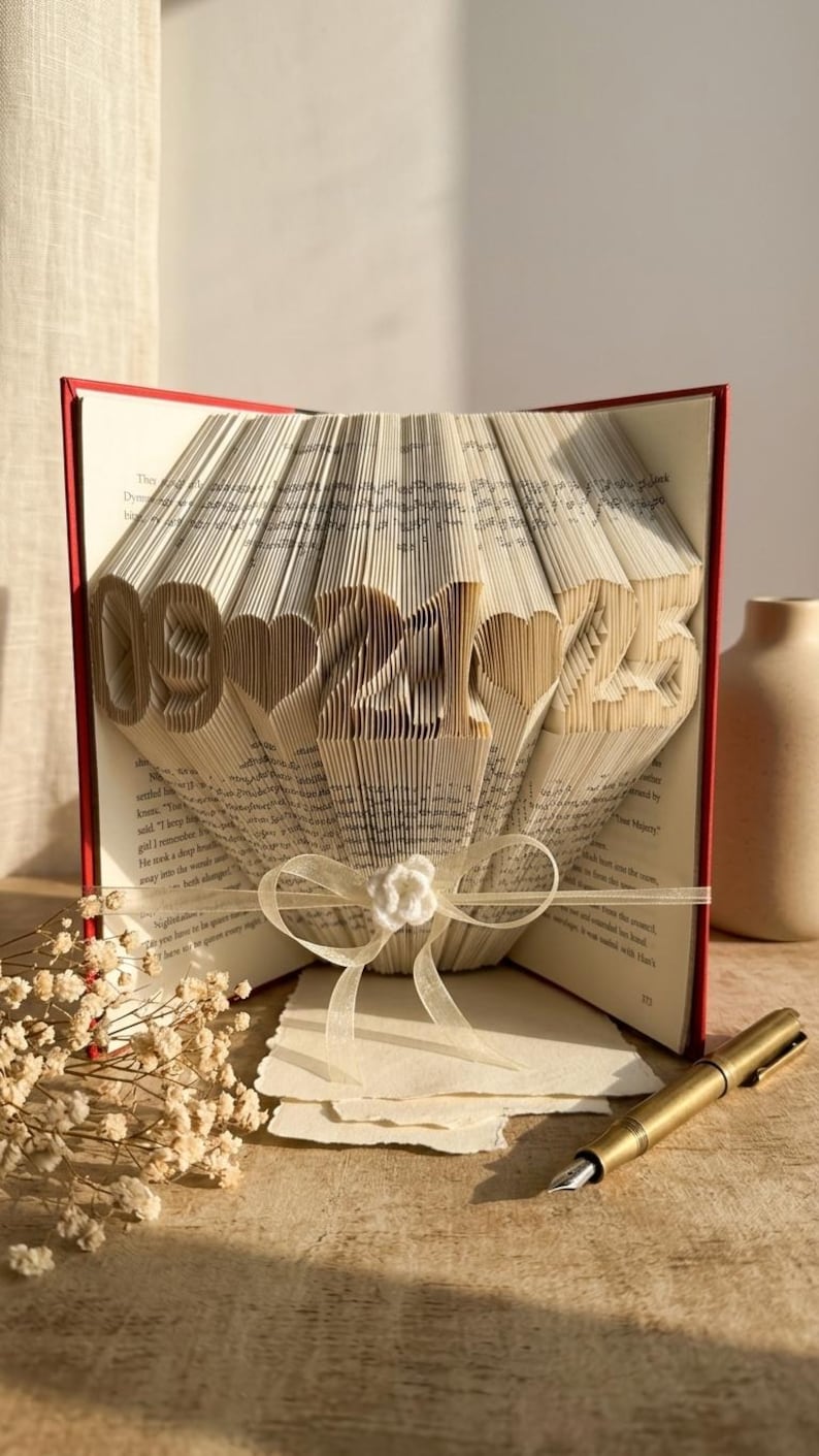 lifestyle image of a folded book with a date design. home decor