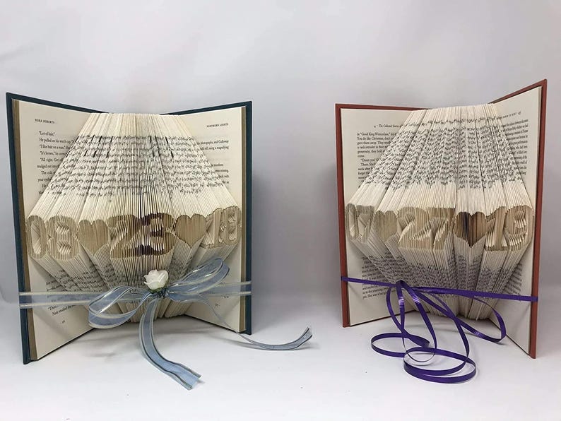two folded books next to each other