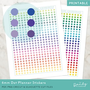 以下が含まれることがあります： 虹色のグラデーションで印刷された6mmドットのプランナー用ステッカー。ステッカーシートには、青、紫、緑、黄、オレンジ、赤など、さまざまな色が含まれています。ステッカーシートは、プランナーやジャーナルで使用するために設計されています。