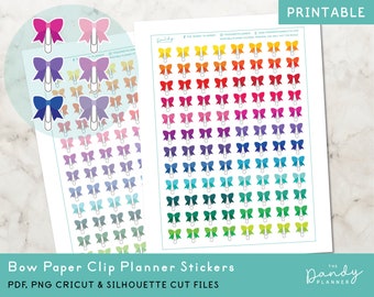 May include: Printable planner stickers featuring a rainbow of colors with a paper clip bow design. The stickers are available in PDF, PNG, Cricut and Silhouette cut files.