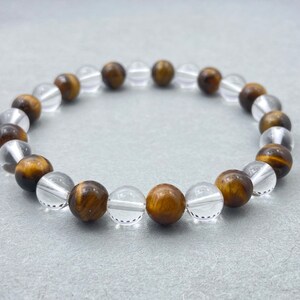 Pulseira de cristal de quartzo e olho de tigre: joias com miçangas e óleos essenciais