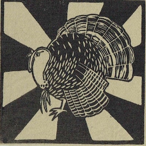 May include: A black and white linocut print of a turkey with its tail feathers fanned out. The turkey is centered on a square background with a black and white starburst design. The artwork has a rustic, vintage feel.