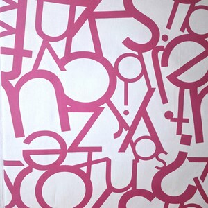 May include: A white background is covered with a pattern of pink letters in various sizes and orientations. The letters are a bold, sans-serif font, creating a modern and abstract design. The letters overlap, adding depth and visual interest to the overall composition.