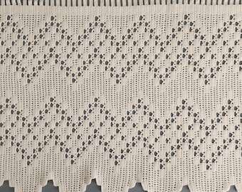 May include: A white crocheted valance with a diamond pattern. The valance has a scalloped bottom edge.